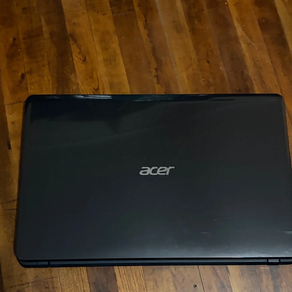 Acer Black Laptop with Silver Logo